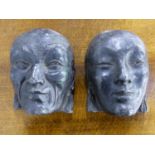 A PAIR OF LEAD MASKS OF A MAN AND A WOMAN IN THE ART DECO TASTE. H.17cms.