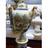 A POTTERY TWIN HANDLED URN, COVER AND STAND DECORATED WITH RURAL SCENES. H.67cms.