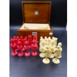 A WALNUT BOXED DIEPPE IVORY RED AND WHITE CHESS SET, THE PIECES CARVED IN EARLY 18th.C.EUROPEAN