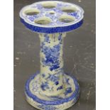 A JAPANESE BLUE AND WHITE PORCELAIN STICK STAND, THE PETAL SHAPED TOP PIERCED WITH FIVE CIRCULAR