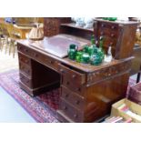 A LARGE VICTORIAN MAHOGANY DICKENS DESK WITH RAISED EIGHT DRAWER AND SHELVED SUPERSTRUCTURE OVER