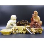 A GROUP OF CHINESE CARVED SOAPSTONE PIECES TO INCLUDE A FIGURE OF A SEATED DEITY, VARIOUS DISHES AND