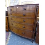 AN EARLY 19th.C.MAHOGANY TALL BOW FRONT CHEST OF TWO SHORT AND FOUR LONG GRADUATED DRAWERS. W.129