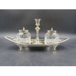 A VICTORIAN TWO BOTTLE INKSTAND WITH CENTRAL TAPERSTICK AND REMOVABLE SCONCE. DATED 1896 SHEFFIELD.