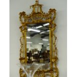 A PAIR OF 18th.C.STYLE CARVED GILTWOOD CHINESE CHIPPENDALE DESIGN WALL MIRRORS. 160 x 80cms.