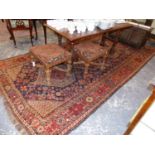 AN ANTIQUE PERSIAN QASHGAI CARPET. 410 x 200cms.