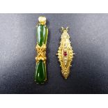 A JADE AND YELLOW METAL (ASSESSED AS GOLD) FLORALLY DECORATED PENDANT, MEASURMENT 6cms, TOGETHER
