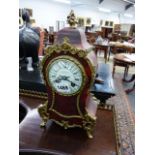 A VICTORIAN TORTOISESHELL AND GILT BRASS MOUNTED ROCOCO STYLE MANTLE CLOCK, THE ENAMEL DIAL SIGNED