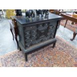 AN ANTIQUE CONTINENTAL BAROQUE STYLE EBONY AND EBONIZED MULTI DRAWER CABINET ON LATER STAND. W.99