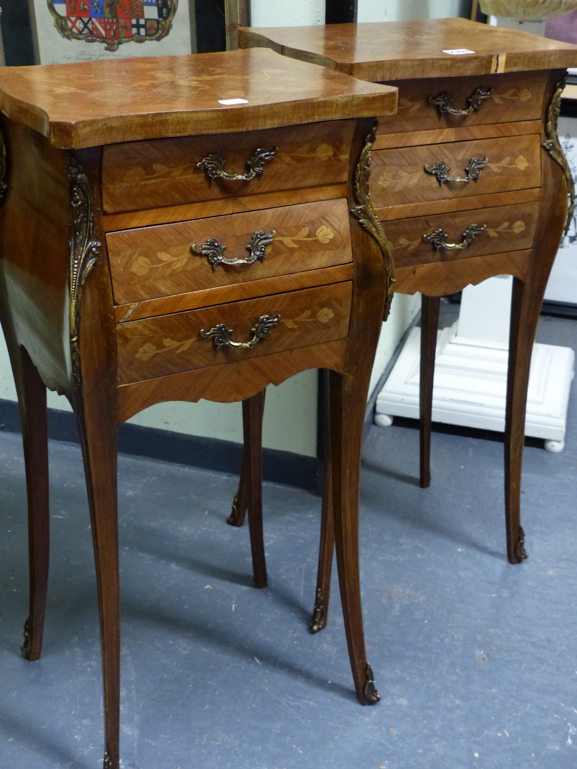 A PAIR OF FRENCH MARQUETRY INLAID LOUIS XV STYLE TWO DRAWER SIDE TABLES WITH SHAPED TOPS AND