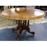 A VICTORIAN BURR WALNUT AND INLAID OVAL TOP BREAKFAST TABLE ON QUADRUPED SUPPORTS. THE TOP, 120 x 90