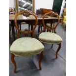 A SET OF SIX VICTORIAN WALNUT BALLOON BACK SALON OR DINING CHAIRS WITH UPHOLSTERED SEATS ON CABRIOLE