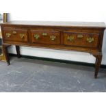 AN 18th.C.AND LATER OAK DRESSER WITH THREE DRAWERS ON SHAPED LEGS WITH ASSOCIATED PLATE RACK OVER.