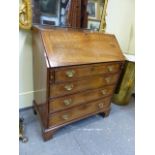 A GEO.III. OAK AND ELM FALL FRONT BUREAU WITH FITTED INTERIOR OVER FOUR GRADUATED DRAWERS ON BRACKET