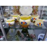 NEWPORT AND WILKINSON POTTERIES CLARICE CLIFF BIZARRE CROCUS PATTERN. FIVE VARIOUS LARGE CREAM JUGS.