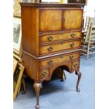 A GEO.I.STYLE WALNUT VENEERED LINEN CHEST/TALLBOY, FITTED A PAIR OF DOORS ENCLOSING A LINEN
