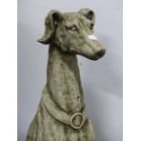 AN IMPRESSIVE PAIR OF COMPOSITE STONE SEATED GREYHOUND FIGURES. (2)