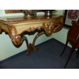 A CARVED AND PAINTED ROCOCO STYLE CONSOLE TABLE
