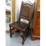AN 18th.C.OAK PANEL BACK SIDE CHAIR WITH TURNED STRETCHERS.