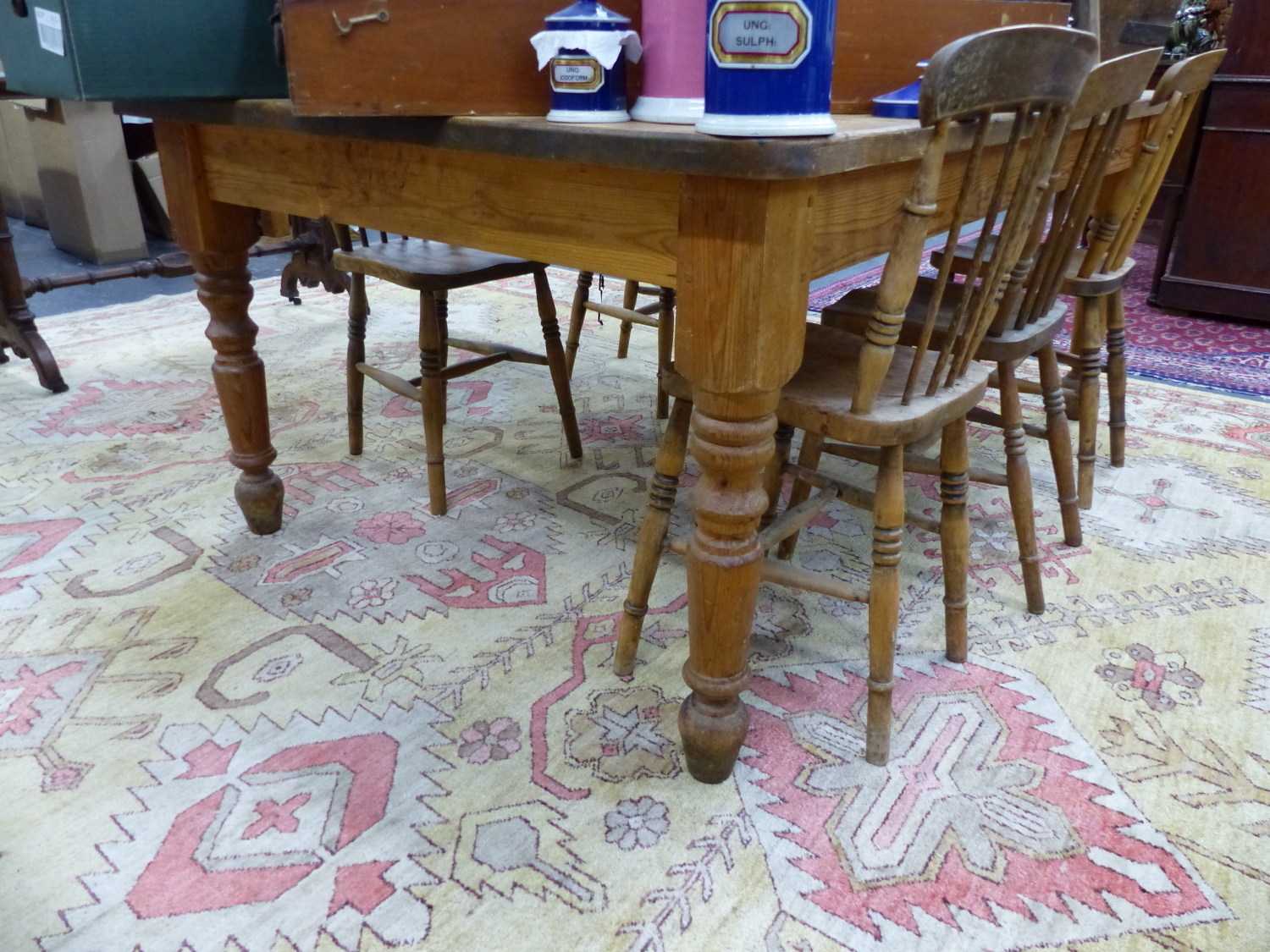 A LARGE PINE KITCHEN TABLE ON TURNED LEGS. 120 x 183 x H.77cms.