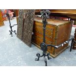 A PAIR OF INTERESTING ARTS AND CRAFTS WROUGHT IRON FIRE DOGS WITH ENTWINED KNOT DECORATION. H.