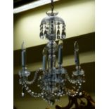 A CLASSICAL FRENCH STYLE CUT GLASS FIVE BRANCH CHANDELIER.