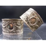 A PAIR OF LARGE ANTIQUE RUSSIAN WHITE METAL NAPKIN RINGS OF OVAL FORM STAMPED 84 STAR, WITH RUBBED