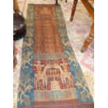 AN INDONESIAN TRIBAL JOINED IKAT PANEL WITH FIGURAL DESIGNS. 280 x 100cms.