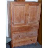 A HEALS LIMED OAK SIDE CABINET WITH TWO DOORS OVER THREE DRAWERS. W.79 x H.131 x D.48cms.