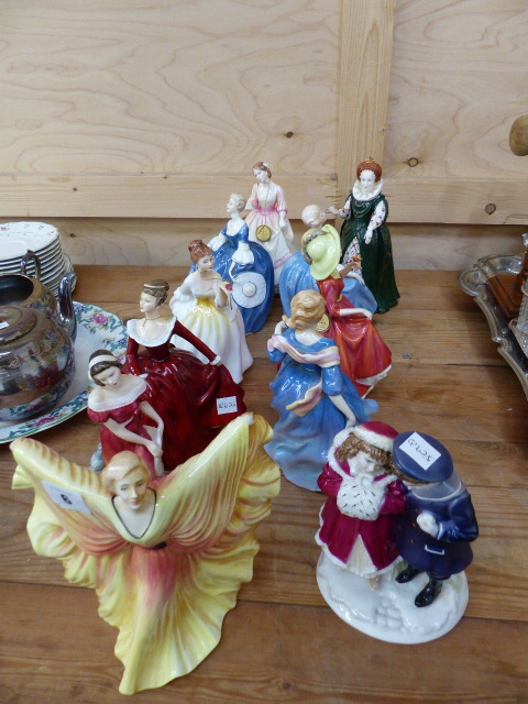 ELEVEN DOULTON FIGURINES.