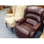 A RECLINING ARMCHAIR AND A WING BACK CHAIR.