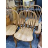A SET OF FOUR SADDLE SEAT HOOP BACK CHAIRS.