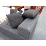 A LARGE DESIGNER SECTIONAL SOFA.