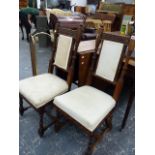 A PAIR OF GOTHIC OAK HALL CHAIRS.