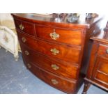 A VICTORIAN BOW FRONT CHEST OF DRAWERS.