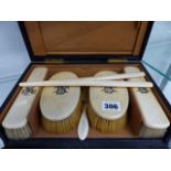 A CASED IVORY BACKED CASED DRESSING TABLE SET.