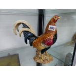 A BESWICK COCKEREL.