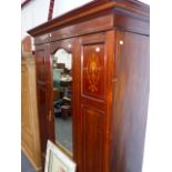 AN EDWARDIAN INLAID WARDROBE.