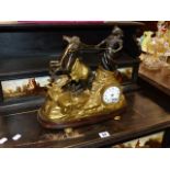 AN ANTIQUE STYLE BRASS MANTLE CLOCK.