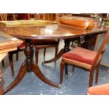 A MAHOGANY REGENCY STYLE THREE PILLAR DINING TABLE.