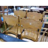 A SET OF FOUR AMERICAN STYLE SPINDLE BACK SIDE CHAIRS.