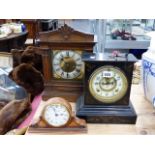 A SLATE CASED CLOCK, A WOODEN KEY WOUND CLOCK AND ONE OTHER.