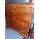 A GEORGIAN OAK AND INLAID CHEST OF DRAWERS.