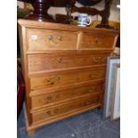 A GOOD QUALITY PINE CHEST OF TWO SHORT AND FOUR LONG DRAWERS.