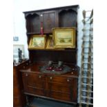 A SMALL OAK DRESSER.