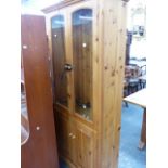 A TALL PINE CABINET.