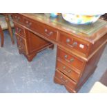 A MODERN TWIN PEDESTAL DESK TOGETHER WITH ASSOCIATED SWIVEL ARM CHAIR.