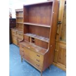 A MID CENTURY TEAK BOOKCASE CABINET.