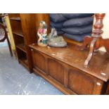 AN OAK BLANKET BOX AND TWO BOOKCASES.