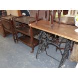 TWO TEA TROLLIES AND A CAST IRON BASED TABLE.